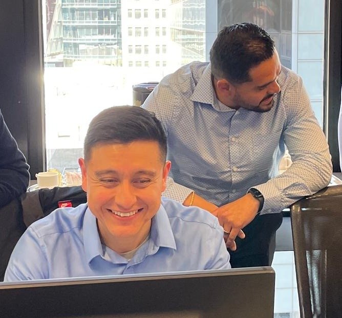 Jonathan Santos and Francisco Santos of STS working through a session at the screens